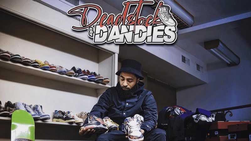 Denzel Carter on the shop floor under the Deadstock & Dandies sign